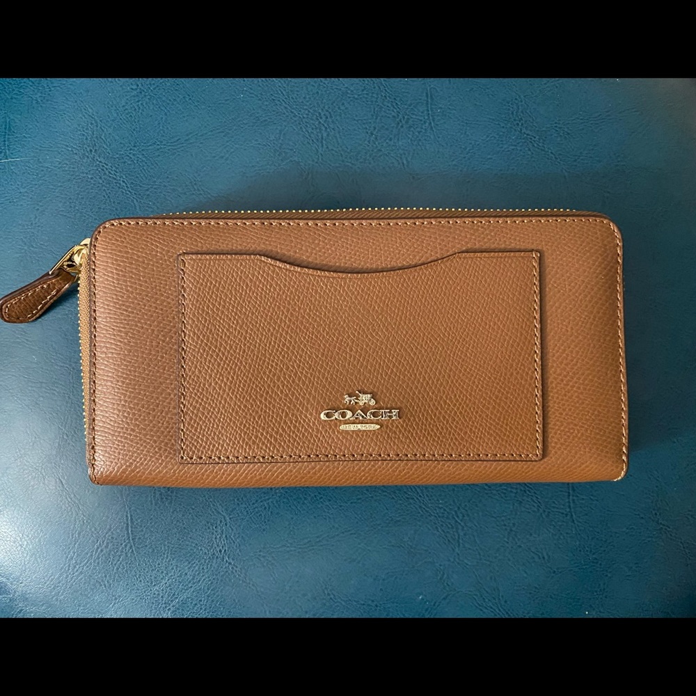 3 accordion style Coach wallets..